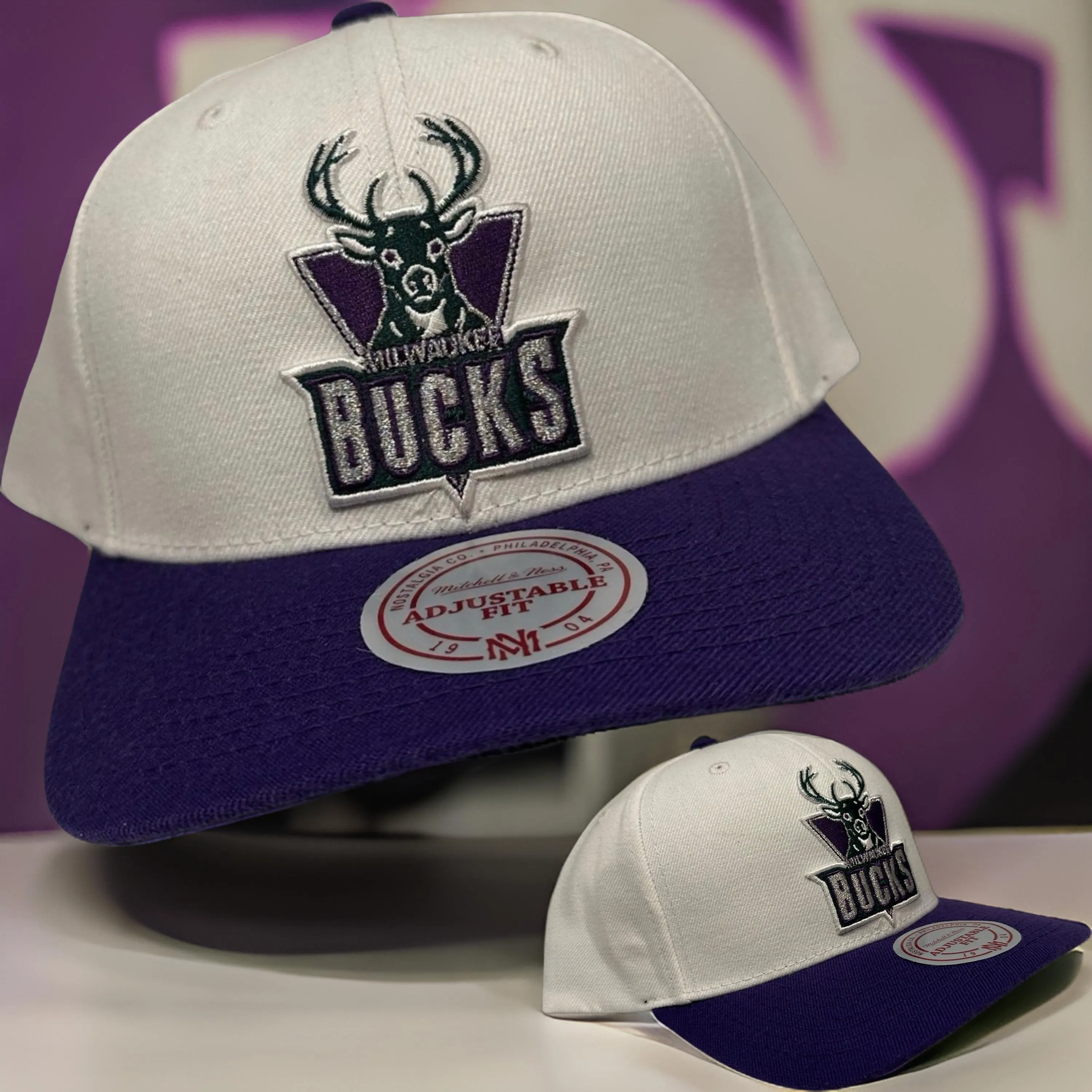 *Milwaukee Bucks* curved beak snapback hats by Mitchell & Ness